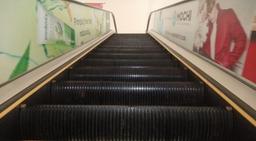 Escalator Branding 2 20 W x 2 H Ft Glass Inside Mall.jpg